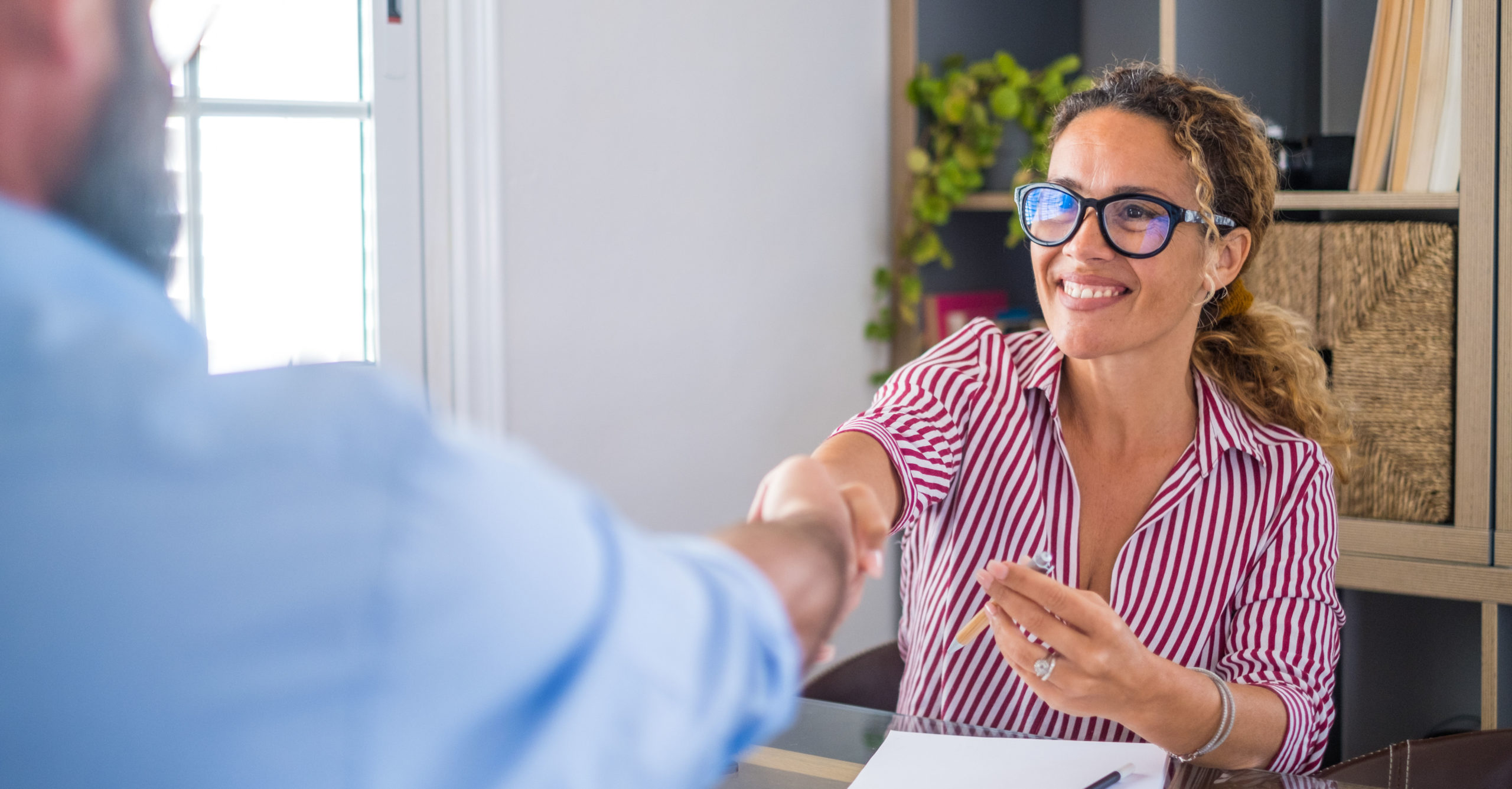 smiling caucasian female hr manager handshake hire 2021 09 02 08 44 13 utc